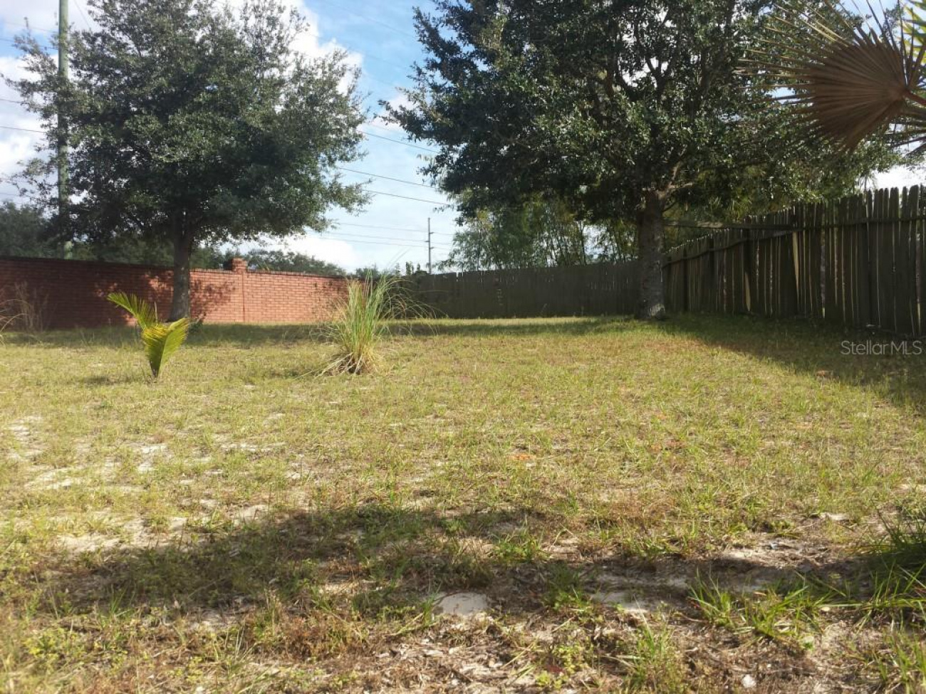Few properties located in residential communities enjoy such a large lot. Imagine what the kids and pets can do when they have this much fenced back yard to work with. If you are a gardener, this is paradise.