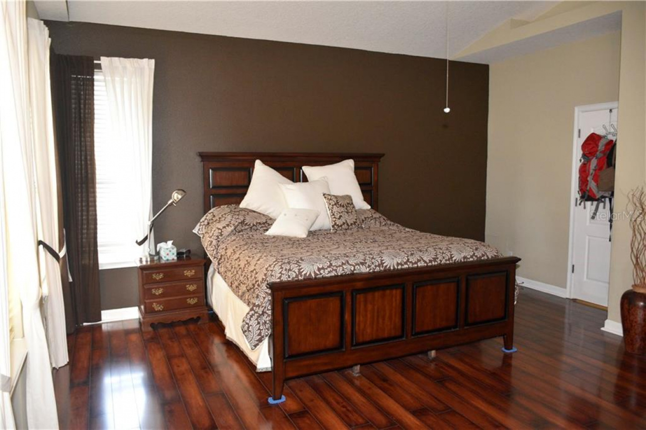 Spacious master bedrooms with laminate flooring and nice high ceilings.