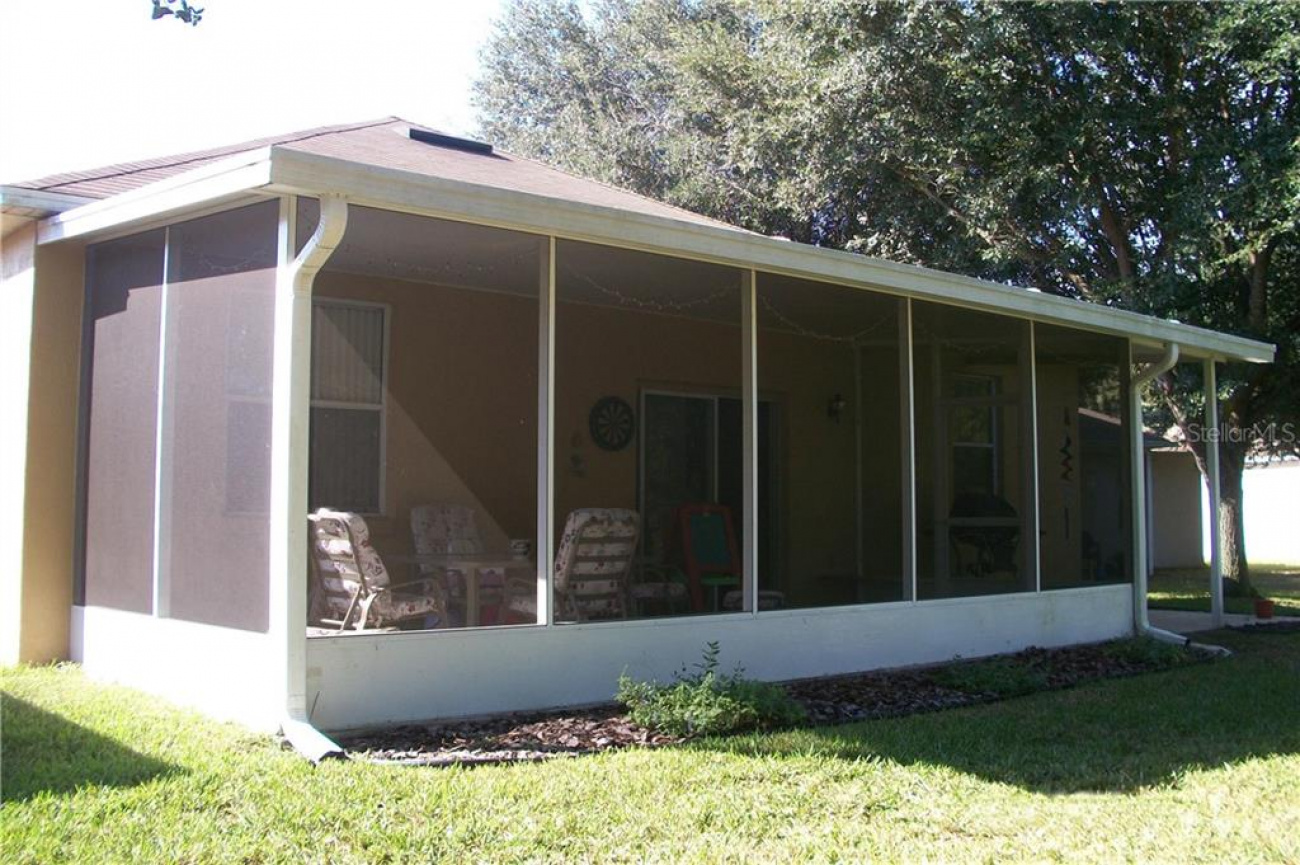The spacious screened porch measures 25 x10 with plenty of room to lounge and enjoy the serenity.