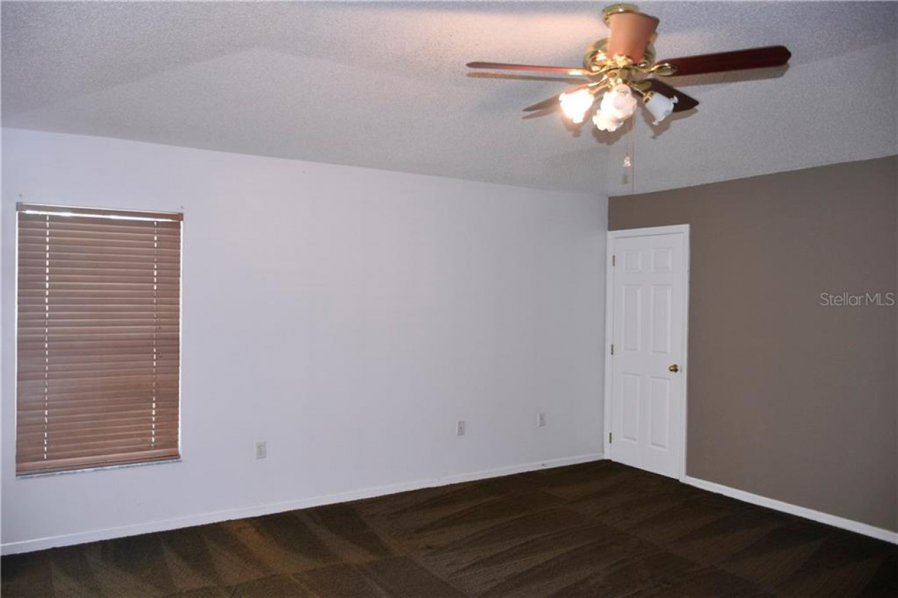 Master bedroom has access to the pool and a walk in closet