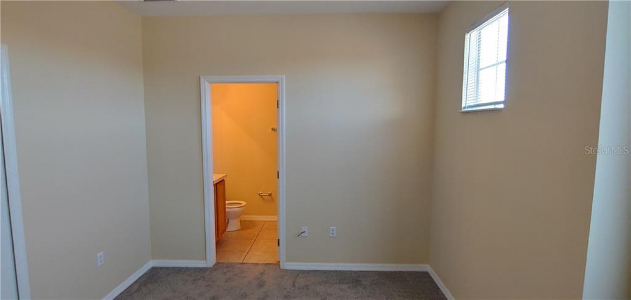 This is bedroom number two, located on the parking lot side of the townhouse, across the hall from master bedroom.